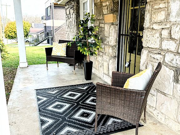 Beautiful, inviting covered front porch which is great for morning coffee afternoon cocktails and entertaining !