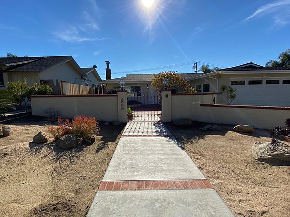 View from the sidewalk to the front patio area.