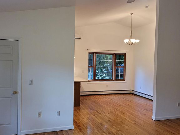 Front door entry, bay window in Dining Room area.