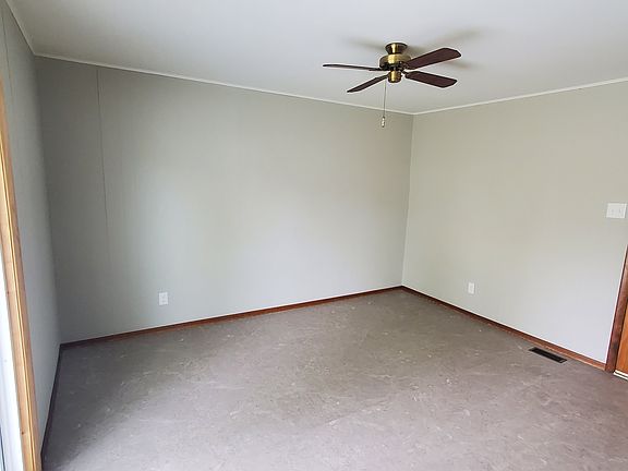 Family room with newer flooring and sliding door out to the back yards.