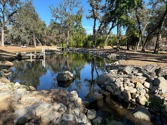 Pond to the front right of house