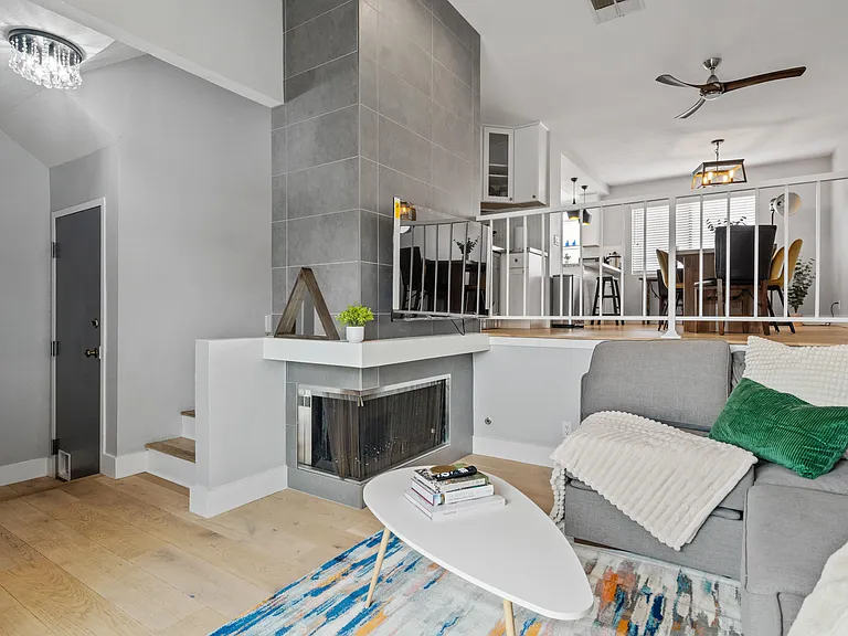 Crafted with sleek lines and modern design, the fireplace serves as a focal point, adding a touch of elegance to the space.