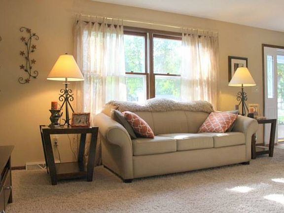 Style and Function. The formal living room greets you to the right of the foyer as you enter the front door. French doors open into the dining area for easy entertaining.