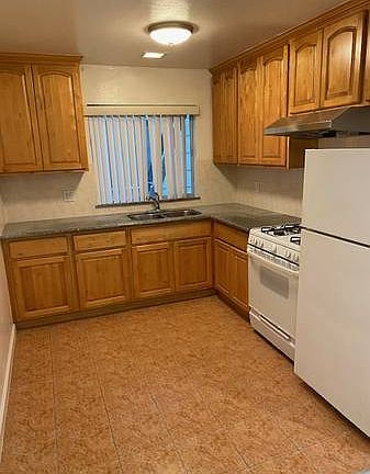 Granite counters, new range hood and fan in the kitchen.
