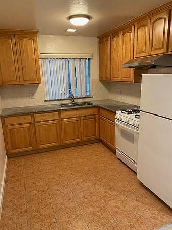 Granite counters, new range hood and fan in the kitchen.