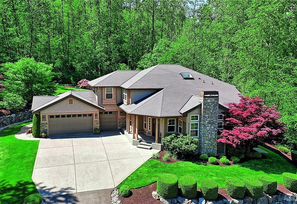 Aerial shot showing the beautiful professionally landscaped front yard.