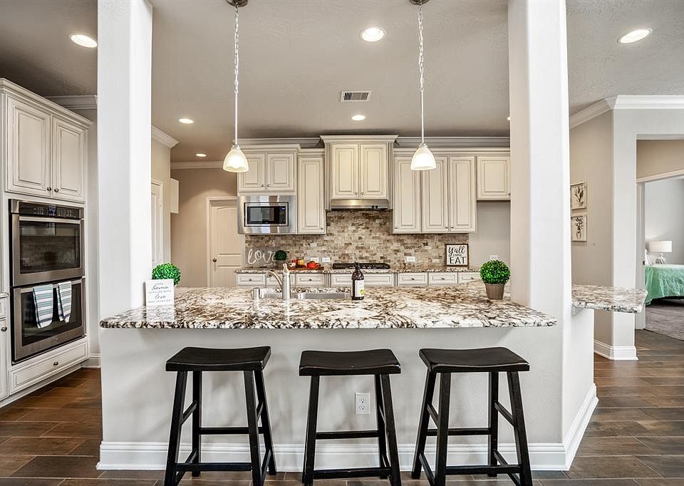 WELCOME HOME TO 8115 Lily Ridge Ln!!! Just take a look at this STUNNING kitchen which is a chef's dream!
