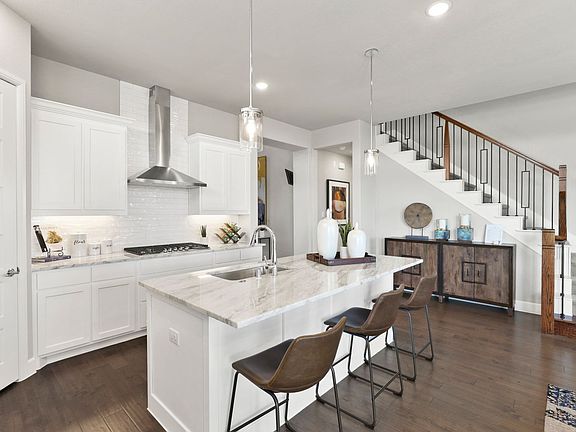 Kitchen in the Greenbrier home plan by Trophy Signature Homes - REPRESENTATIVE PHOTO