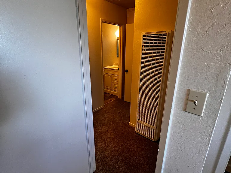 hallway with wall heater