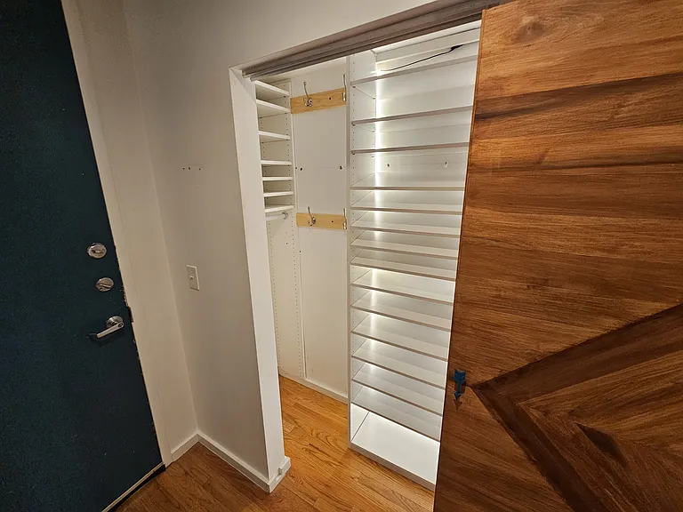 Large closets with custom shoe shelving