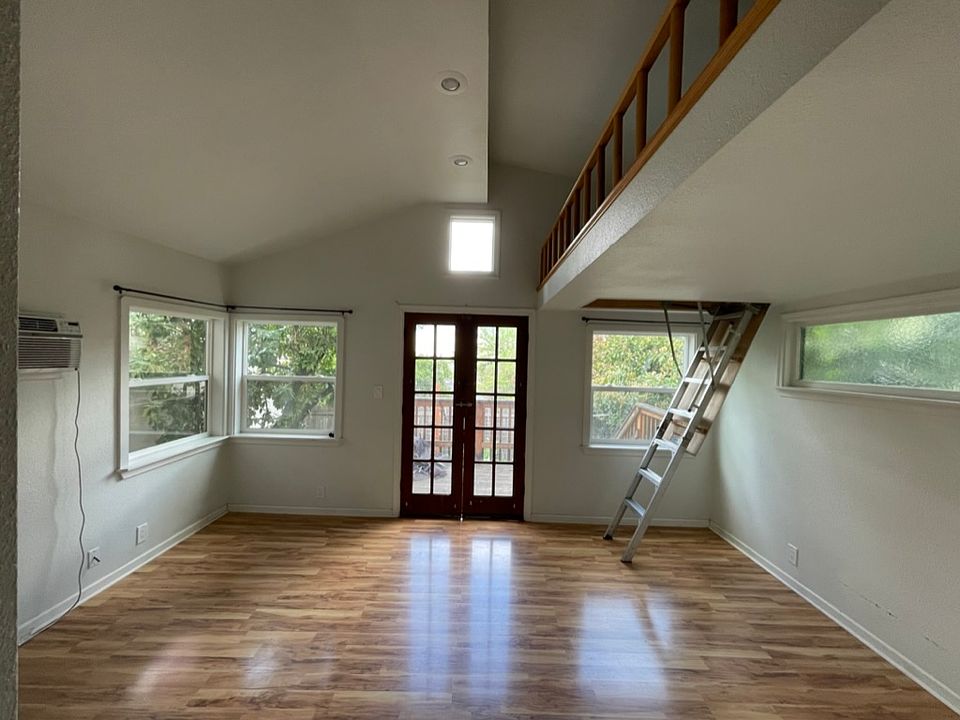 Living area with stairs to loft