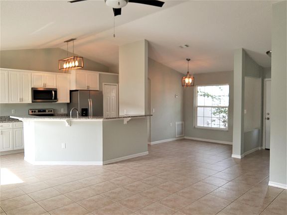 Front door is to the right of the dining room.