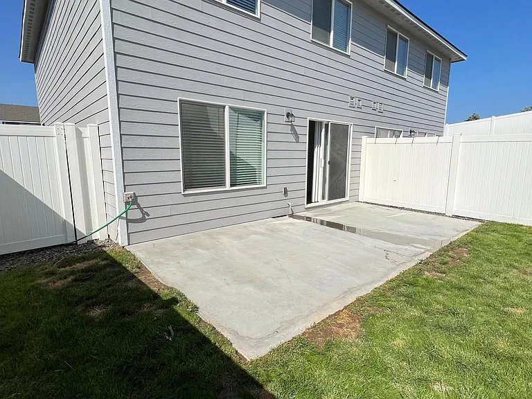 Fully fenced backyard with sprinkler system