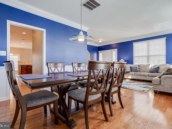 Formal Dining Room With Wide Plank Hardwood Floors