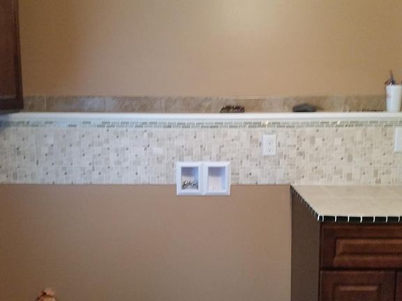 laundry connections with storage cabinets