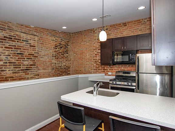 Kitchen with stainless appliances, dishwasher & granite countertops & island