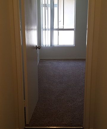 Hallways have dark wood floors