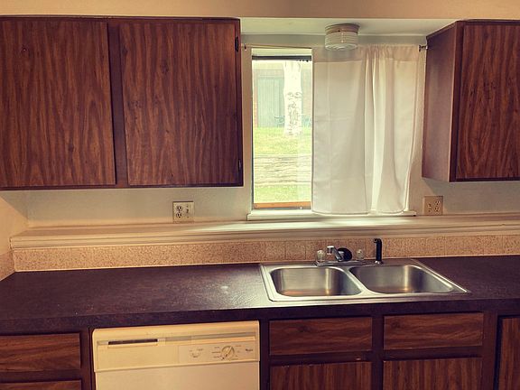 Close up of the kitchen, which has a window to the space behind the apartment block (which is shared with the next block of apartments).