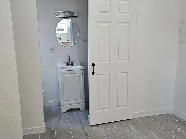 downstairs bathroom entrance with barn door