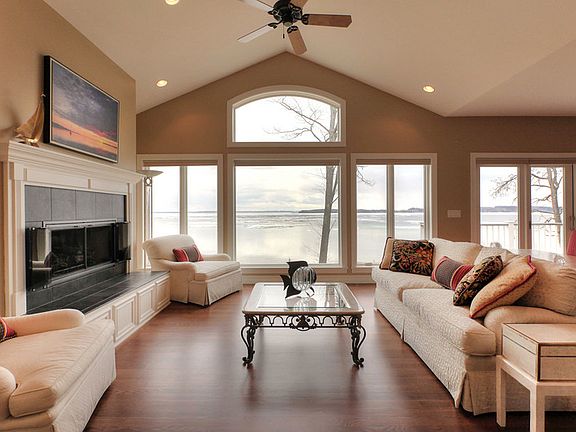 Panoramic View of Grand Traverse Bay
						:
						Breathtaking View -Great Room
Fireplace Has Raised Hearth for Extra Seating