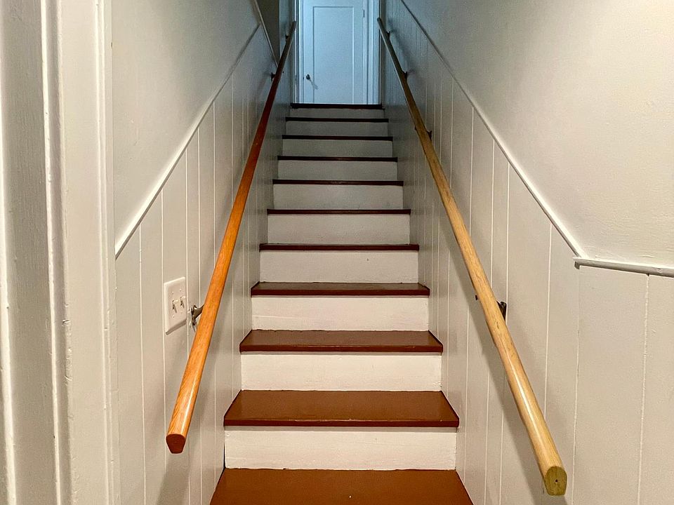 Stairway leading up to unit. Includes entryway cubby space. Separate entrance to the unit on the side of the house.