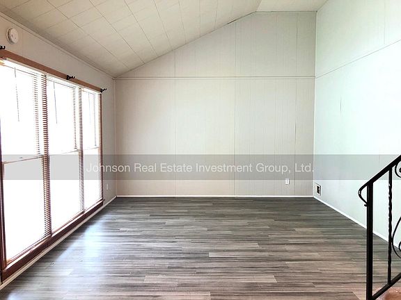 Large living room with luxury vinyl plank flooring.