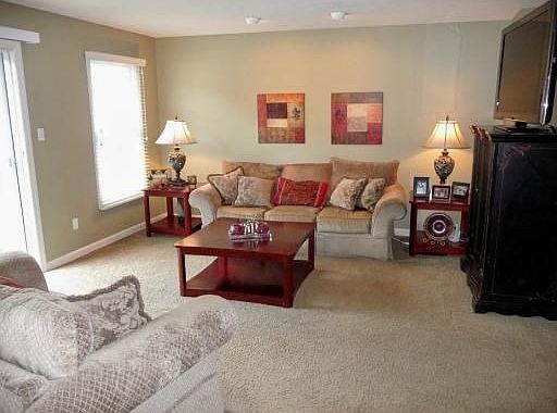 First floor family room w/upgraded carpet, recessed lighting, door to patio.