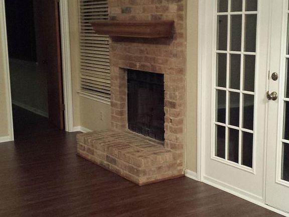 View from Kitchen to fireplace and master bedroom entrance