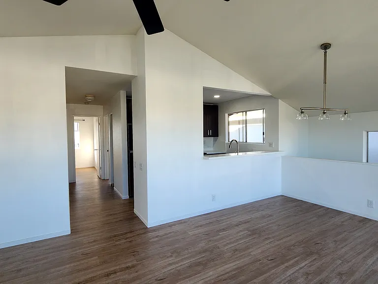 Looking Towards Dining Area, Kitchen and Bedrooms