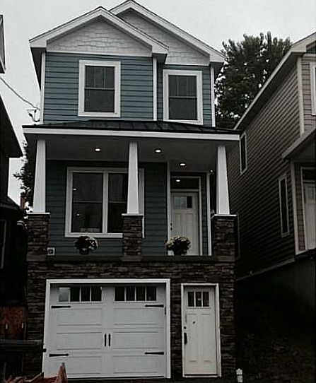 Exterior Front. Steps and permeable pavers going in. Rain-garden in backyard will be completed in a 