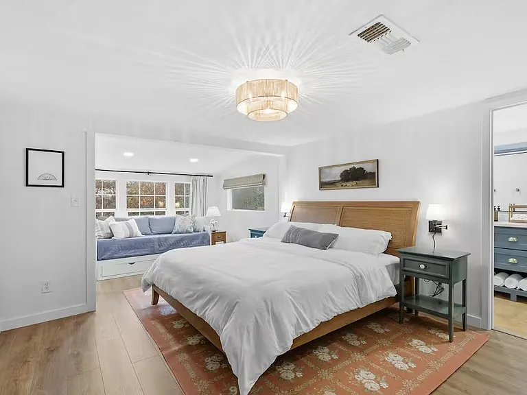 Master bedroom with King bed and day bed / couch that converts into a Queen bed