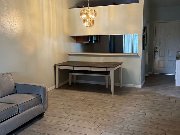 great living and dining room with vaulted ceilings.