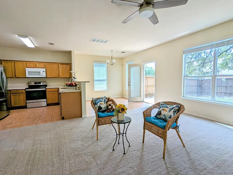 Bright living room, open floor plan. Backyard view