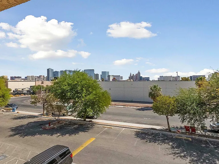 Enjoy breathtaking city views from your private balcony, surrounded by vibrant greenery.
