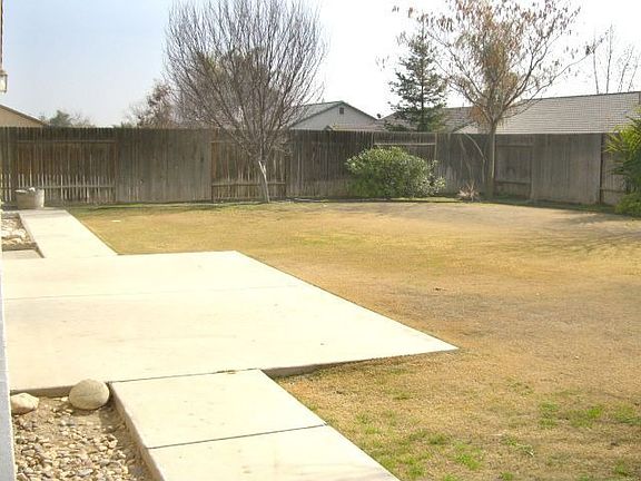 Large rear yard with patio