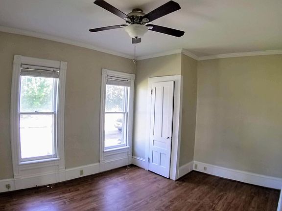 Master bedroom with ceiling fan, All new floors!