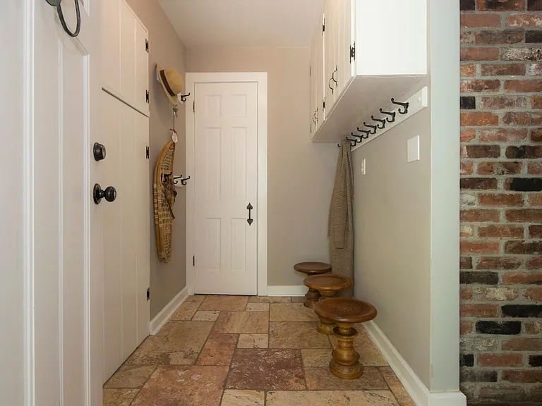 Foyer entrance with closets.