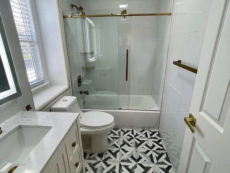 Bathroom with walk in shower/tub on second floor.