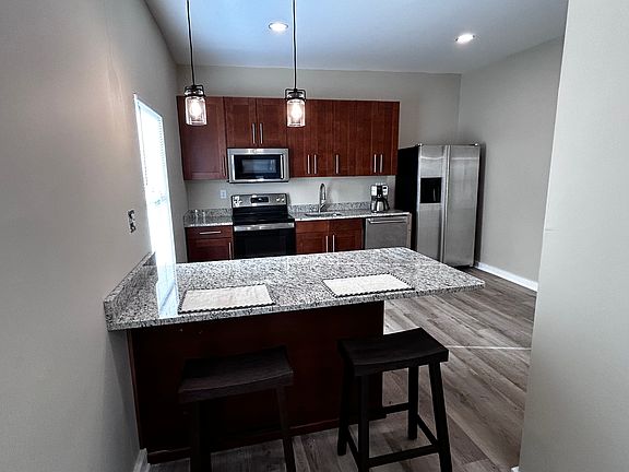 Kitchen view-Granite/ Stainless Appliances & Premium Cabinets
