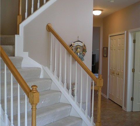 2 story foyer entry with ceramic tile flooring