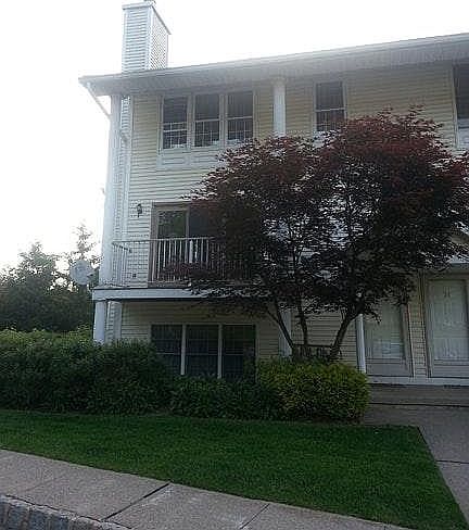 Beautifully Landscaped End Unit with Balcony