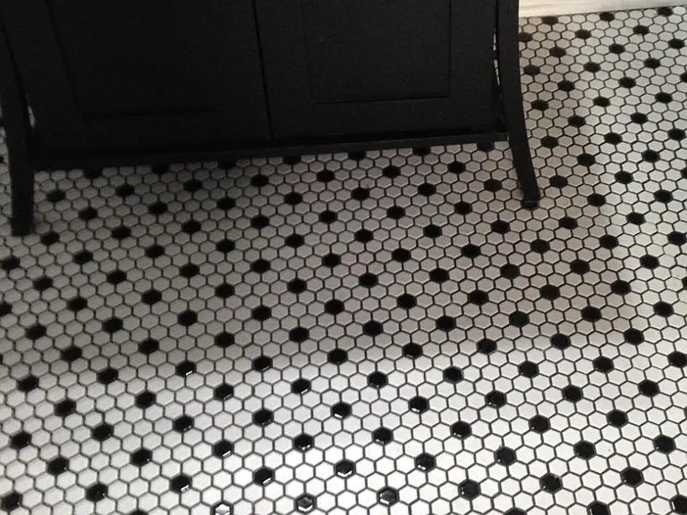 Penny tile floor and new cabinetry with bowl sink in en suite main bathroom