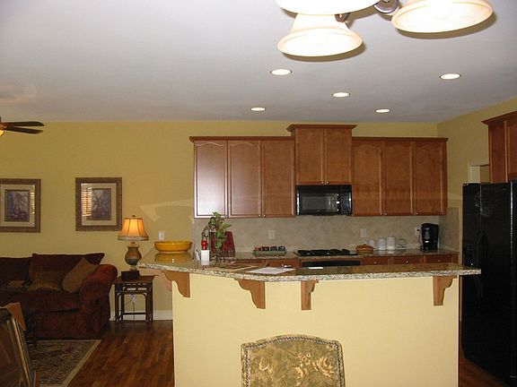 Large open kitchen overlooking family room, keeping room and breakfast area