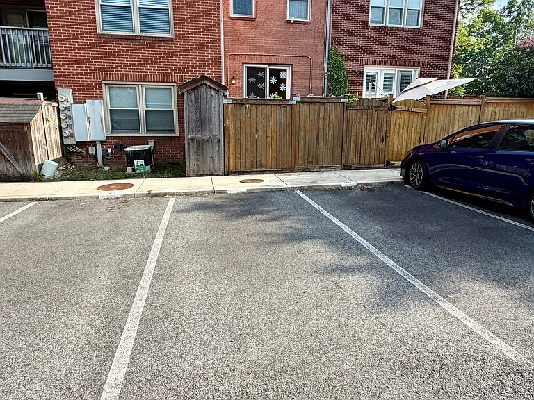Designated parking spot behind the apartment.