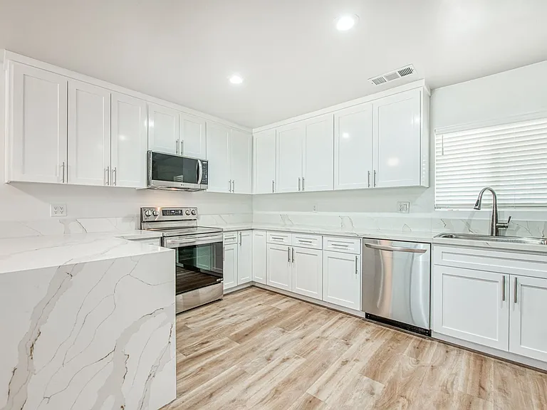 Luxury Kitchen & Appliances, LVP Flooring, Quartz Countertops, Central Heating & Cooling, New Windows.