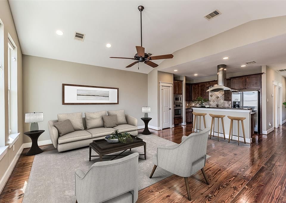 Get an idea how this 2 Bedroom/2 Bath townhome in the gated community in vibrant EaDo can look from this virtual staging! Great floor plan for entertaining as the kitchen overlooks the living area with 3 large windows. Gleaming hardwood floors throug