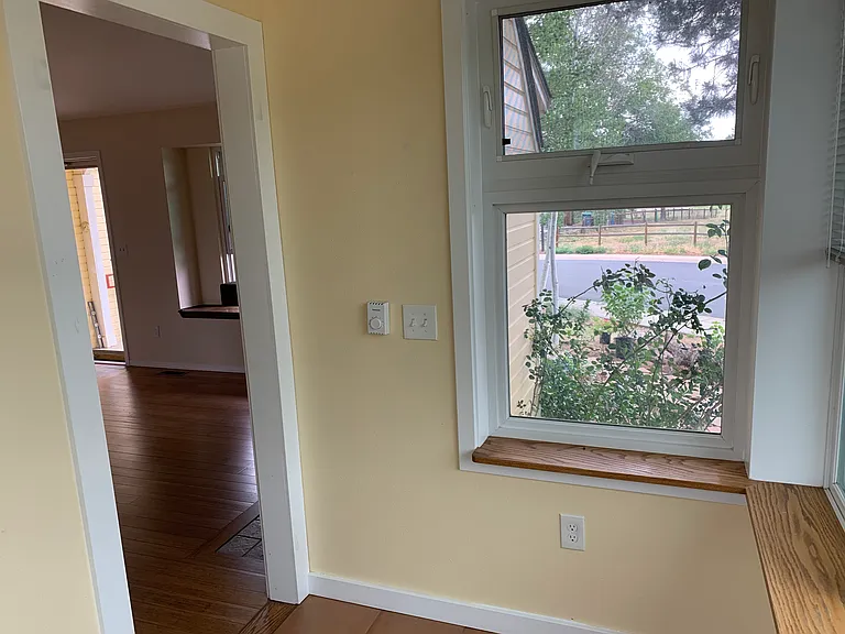 View from sunroom back toward front door