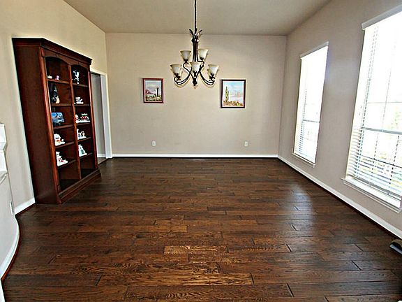 GRACIOUS ENTERTAINING WILL BE YOURS IN THE FORMAL DINING ROOM WITH GLEAMING HARDWOOD FLOORS