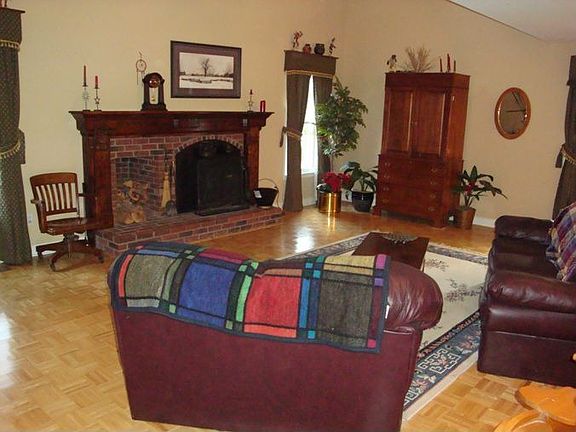 2 StoryLiving Room Features Hardwoods, Wood Burning Fireplace, and Ceiling Fan