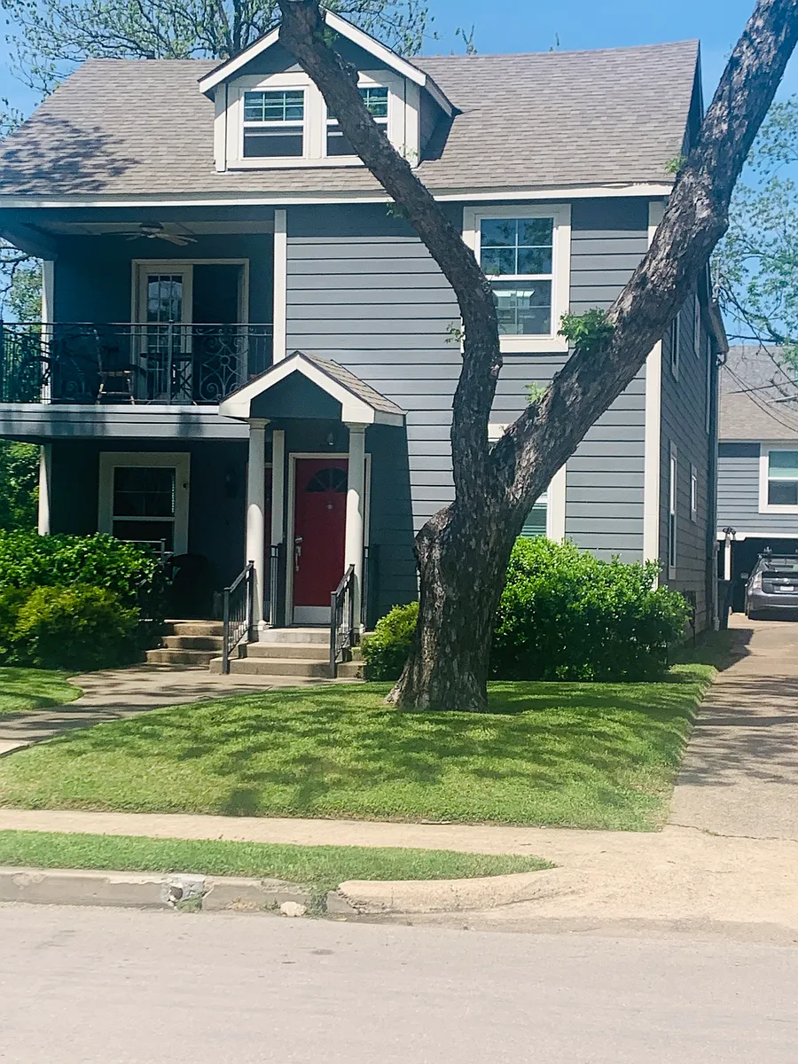 Front door seen on right walks upstairs to upper home with upper private front and back balconies. - 5907 Vickery Blvd